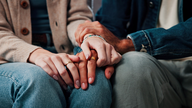 Couple holding hands