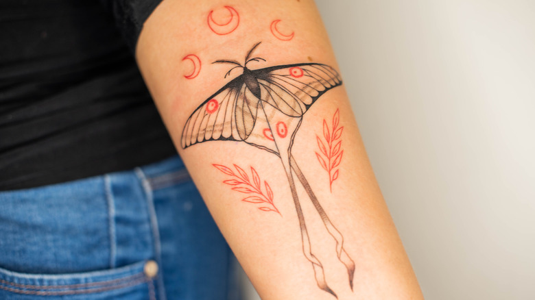 tattoo of a butterfly on an arm