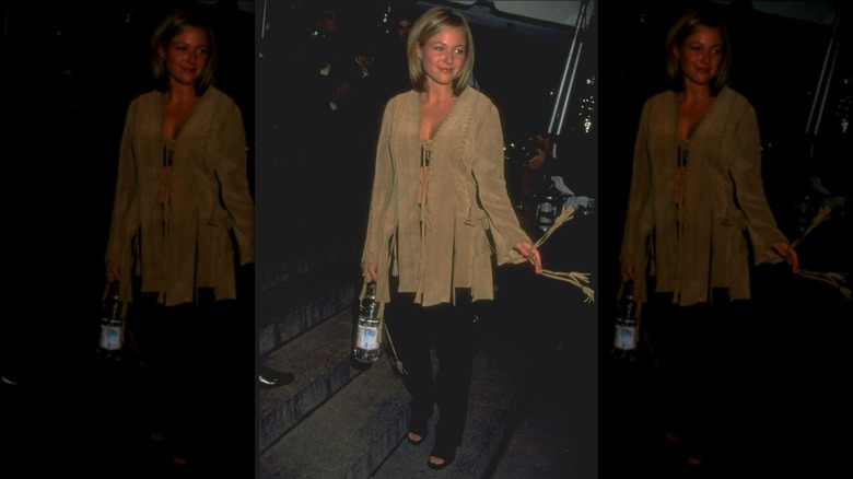 Jewel in a suede jacket and black pants at the 1996 Met Gala
