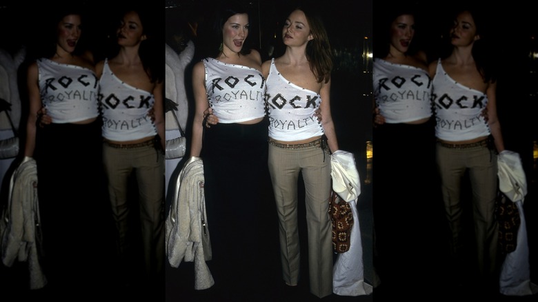 Liv Tyler and Stella McCartney posing together at the 1999 Met Gala in matching tops