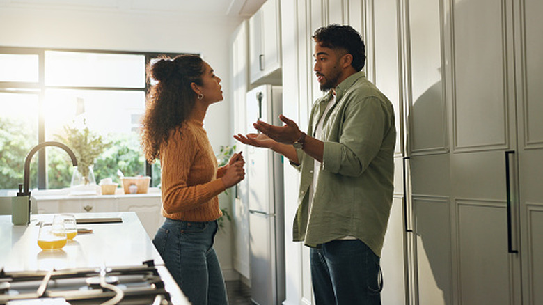 Couple fighting in kitchen