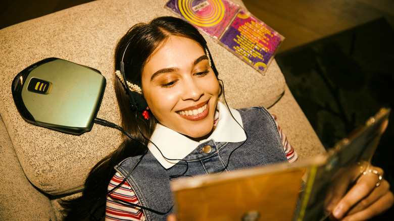 Young woman holding a CD case