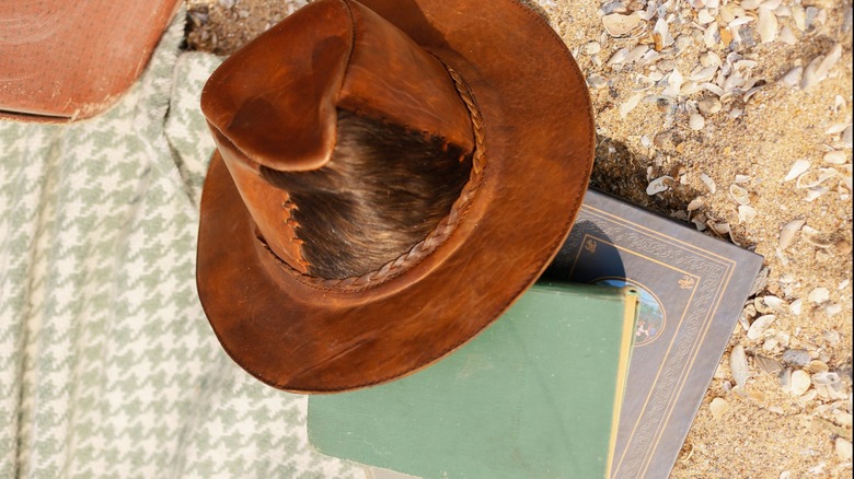 Cowboy hat on a stack of books