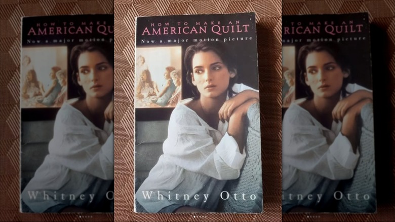 A copy of the book "How to Make An American Quilt" laying on a patterned textile