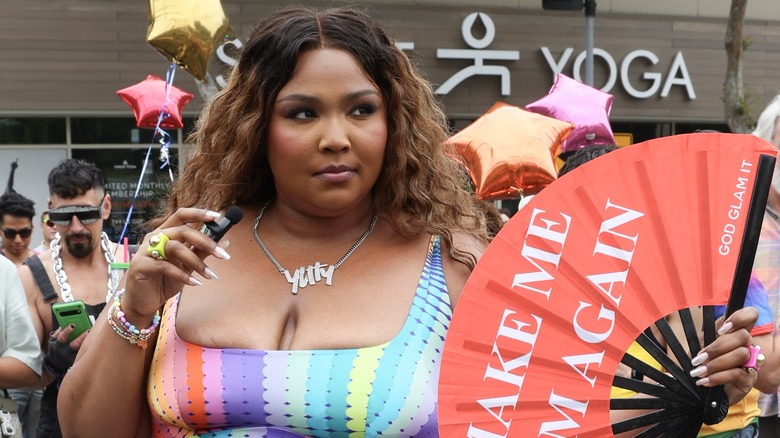 Lizzo holding fan