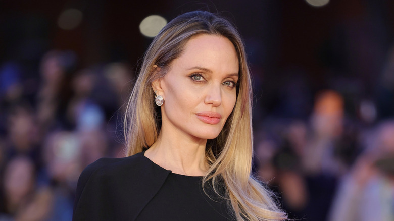 Angelina Jolie wearing a black dress on the red carpet