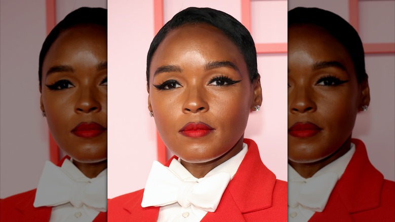 Janelle Monáe looking into the camera with fluffy brows and dramatic eyeliner