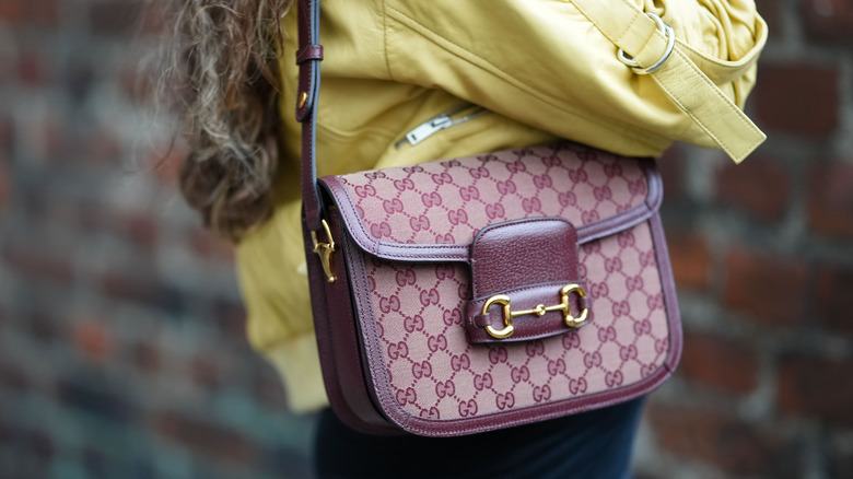 Woman carrying Gucci bag