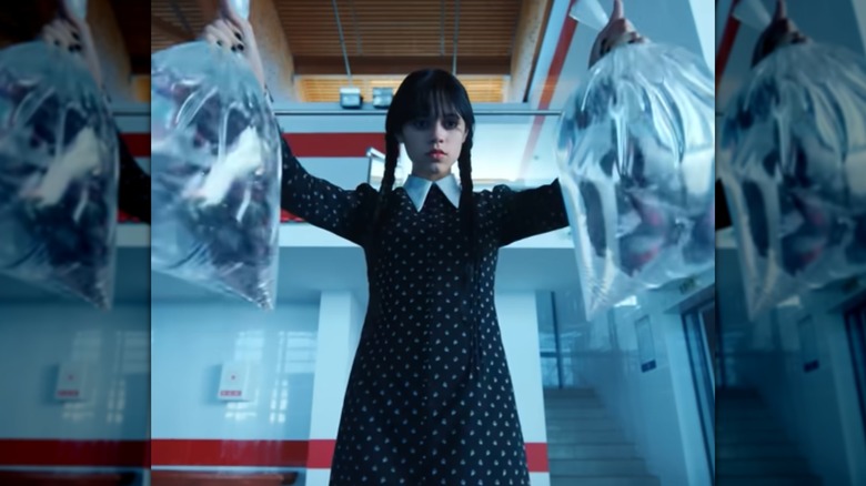 Wednesday Addams wearing a black dress