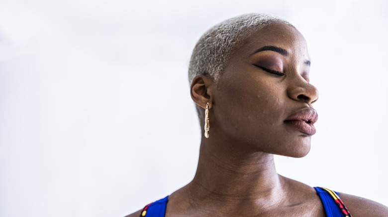 Woman with short white buzz cut