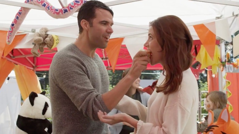 Julie Gonzalo as Angela Young and Benjamin Ayres as Jeff Callan in Hallmark Channel's Falling for Vermont (2017)