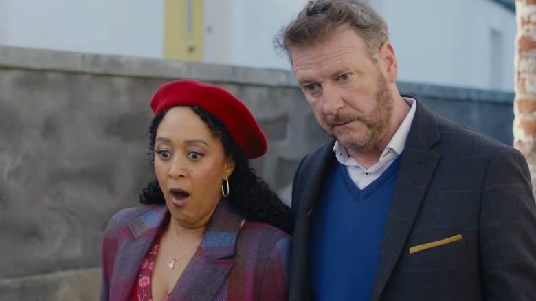 Tamera Mowry-Housley as Gethsemane Brown and Risteárd Cooper as Eamon McCarthy in Haunted Harmony Mysteries: Prelude to a Wedding (2026)