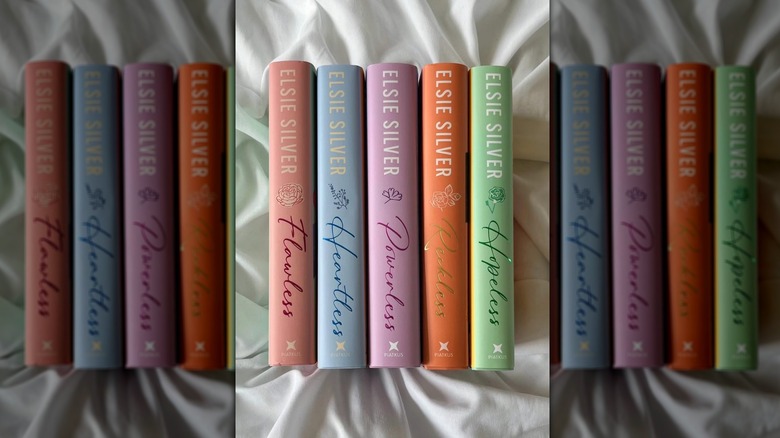 The Chestnut Springs series books lined up next to each other on a silky sheet