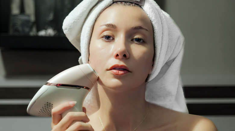 A woman using a laser hair removal