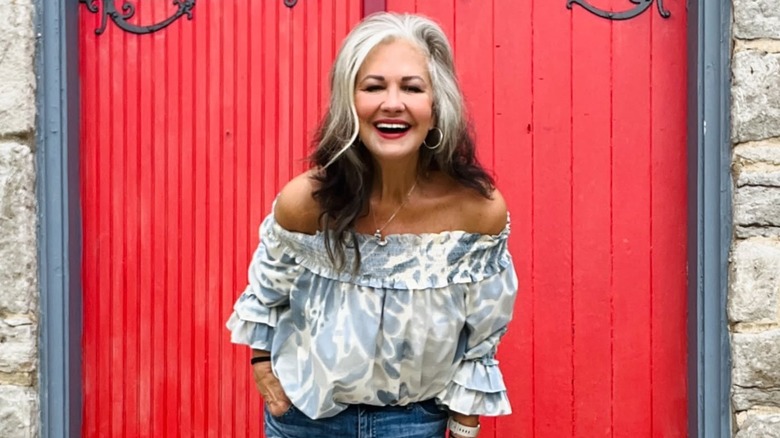 A woman with gray hair at the beach