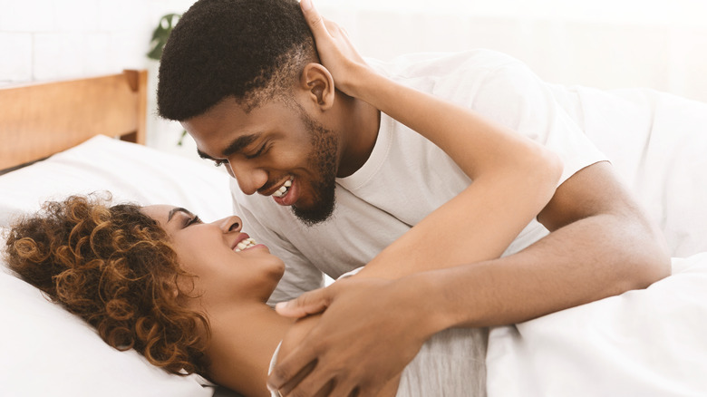 couple cuddling in bed