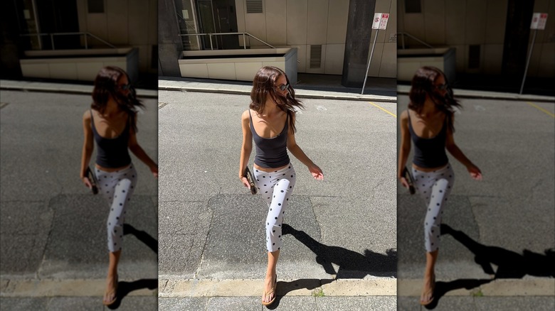 Woman wears patterned capri leggings