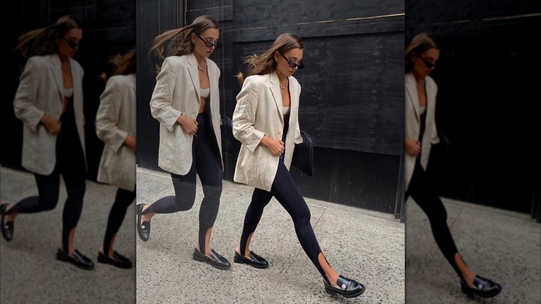 Woman wears stirrup leggings