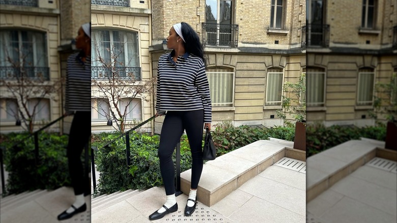 Woman wears black leggings