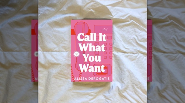 A copy of "Call It What You Want" laying on a white sheet