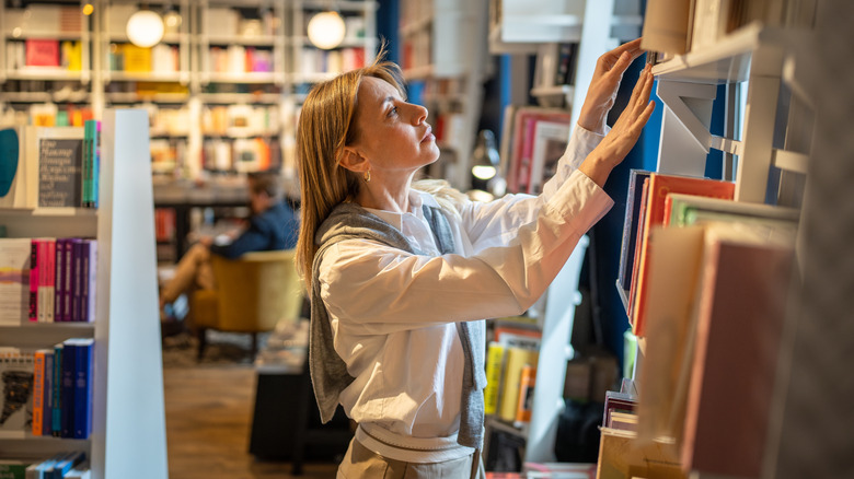 Woman looking at books