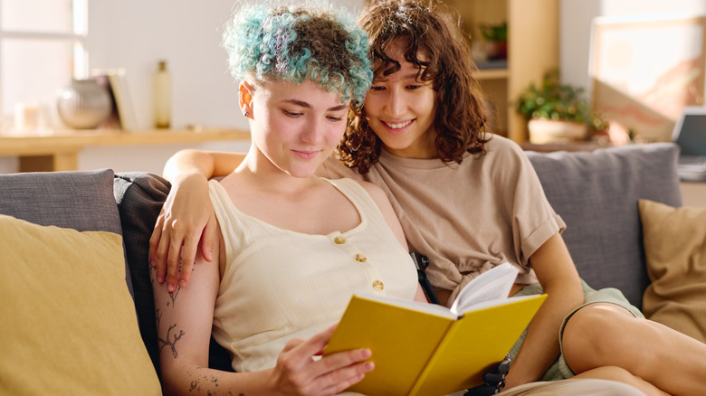 Queer couple reading a book