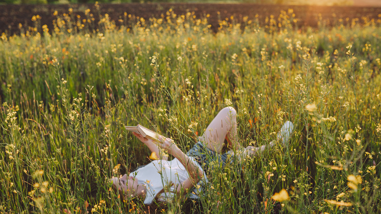 Woman reading in a field