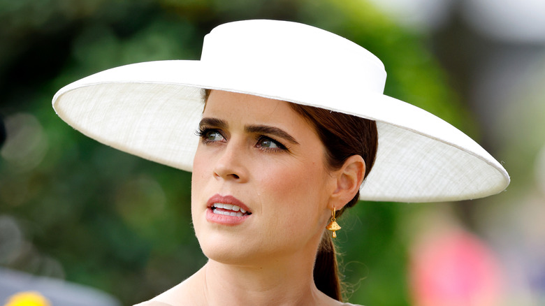 Princess Eugenie wearing a big white sun hat