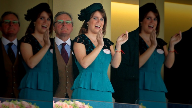 Princess Eugenie clapping and wearing a teal dress