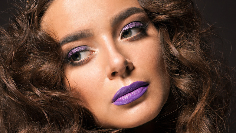 Julia Fox wearing purple makeup