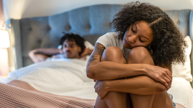 Woman sad in bed