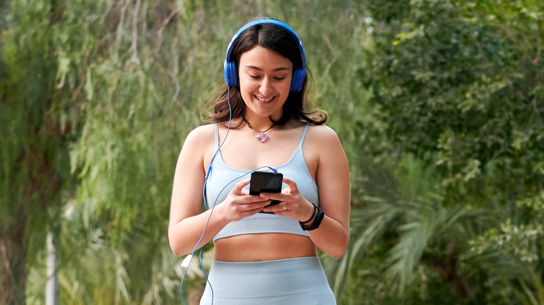 Woman listening to audiobook on a walk