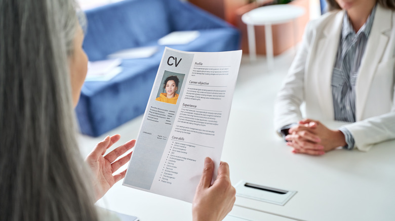 Woman assessing resume