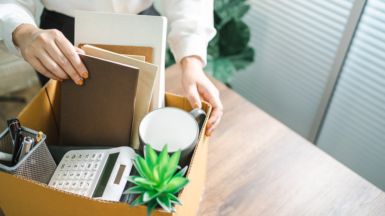 Packing a box, leaving work