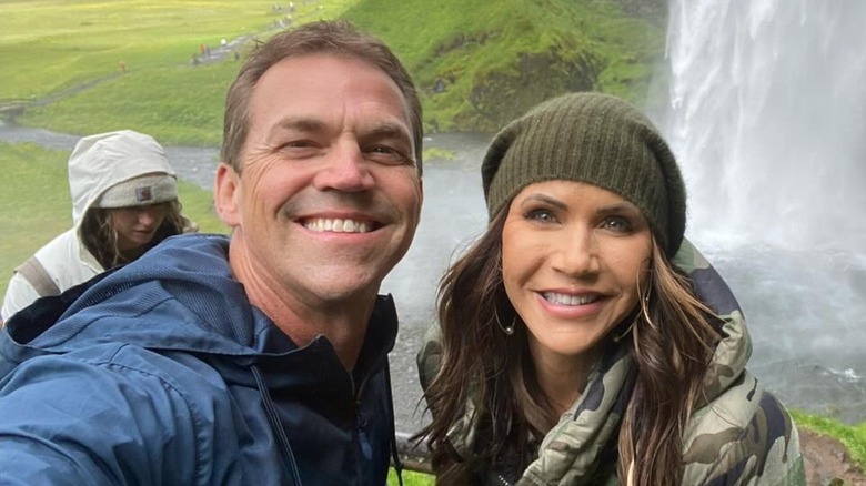 Bryon Noem with Kristi Noem in front of a waterfall