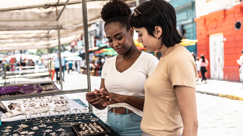 women trying on jewelry