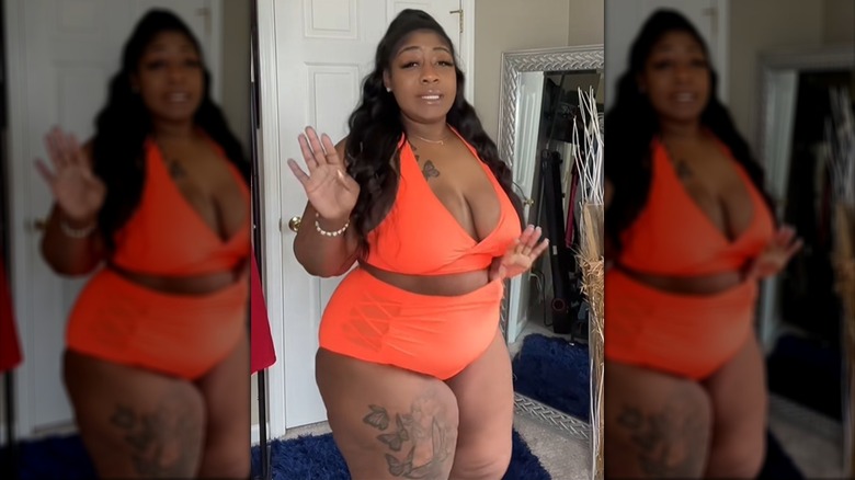 A woman wearing a neon orange high-waisted bikini inside