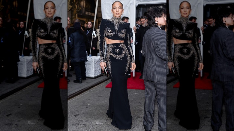 Jennifer Lopez in a black two piece skirt suit outside of Othello