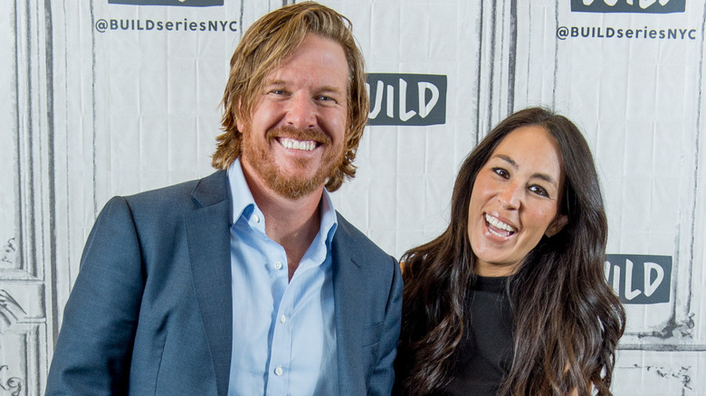 Chip and Joanna Gaines standing together at an event