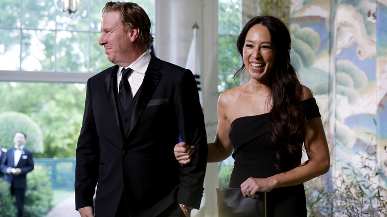 Chip and Joanna Gaines in black tie outfits at an event