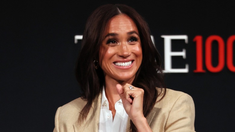 Meghan Markle smiling on the red carpet
