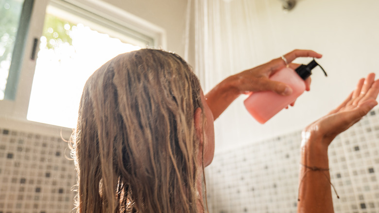 blonde woman conditioning in shower