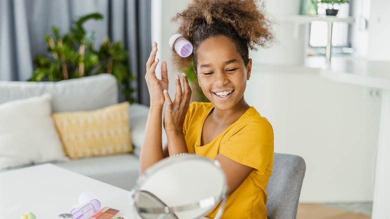 Woman applying rollers