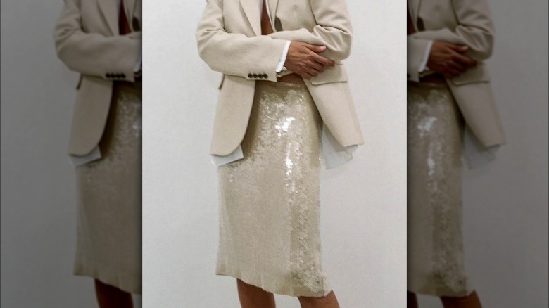 Woman in a blazer and sequin pencil skirt 
