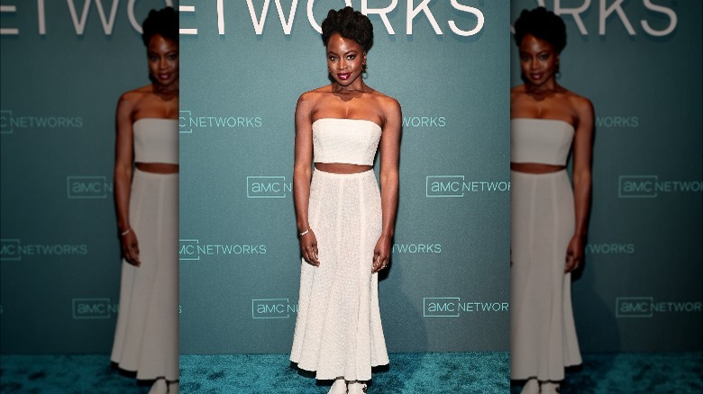 Danai Gurira in a tube top and skirt 