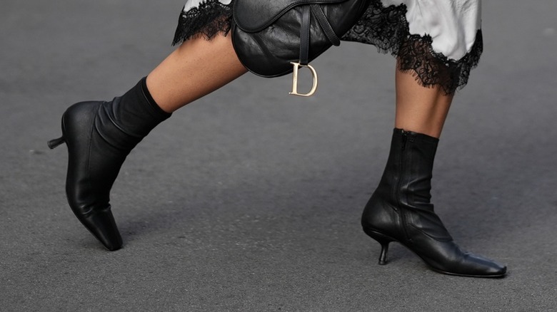 A woman wearing fitted boots