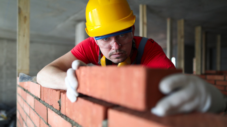 Builder working on a wall