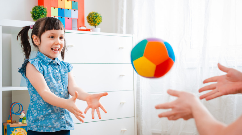 Girl playing catch