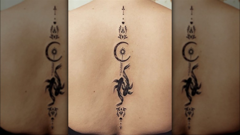 Pisces back tattoo