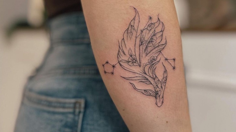 Girl with Pisces tattoo